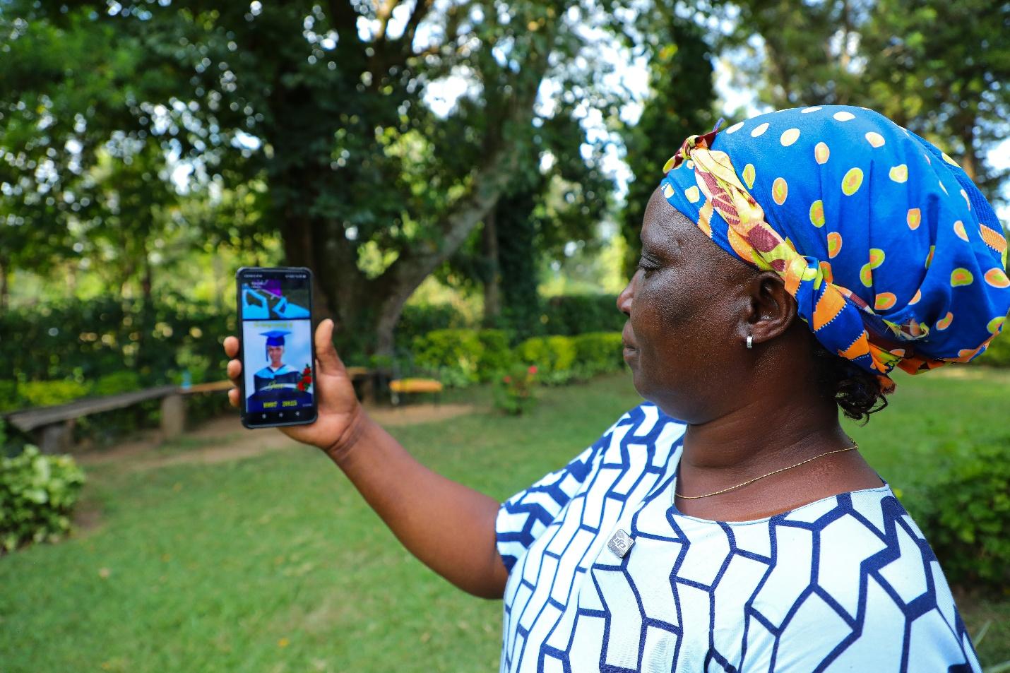 Woman looking at a picture on her phone.
