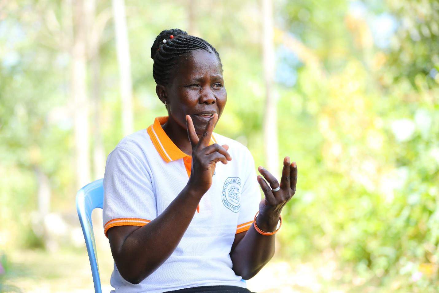 Woman sitting on a chair speaking